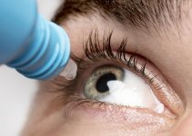 man-using-eye-drops-close-up-1-scaled.jpg
